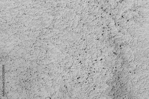Abstract gray background. Gray stucco texture. Rough surface.