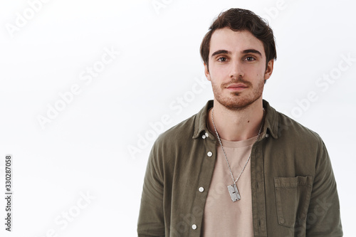 Close-up portrait of handsome smiling young man with beard and moustache standing in casual outfit with normal expression, relaxed friendly face, person standing white background