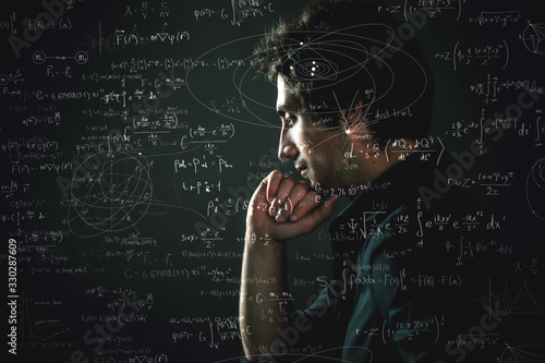 Training and research, concept. Pensive man and physical and mathematical formulas