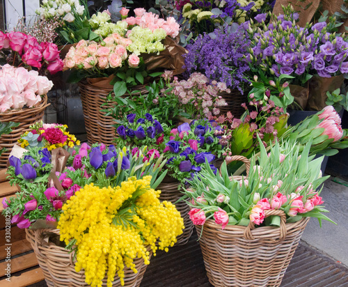 fragrant colorful spring flowers in wicker baskets