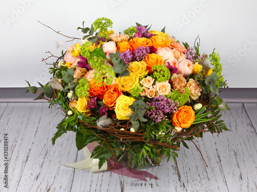 Flower arrangement with roses, lilac and alstroemeria