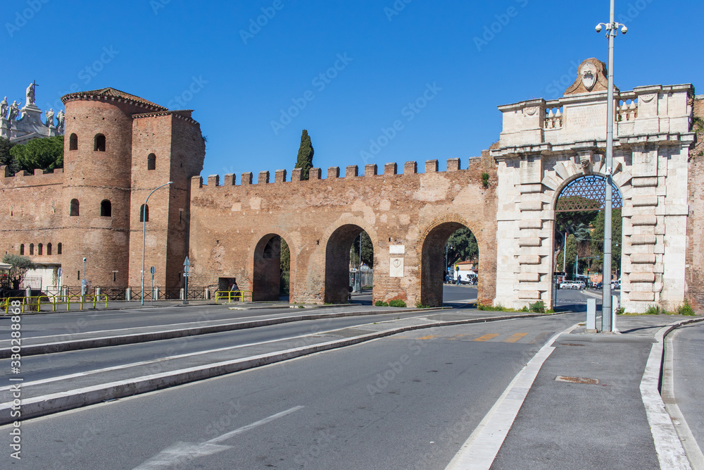  Rome, Italy - following the coronavirus outbreak, the italian Government has decided for a massive curfew, and now even the main Old Town landmarks, like Porta S.Giovanni, are totally empty