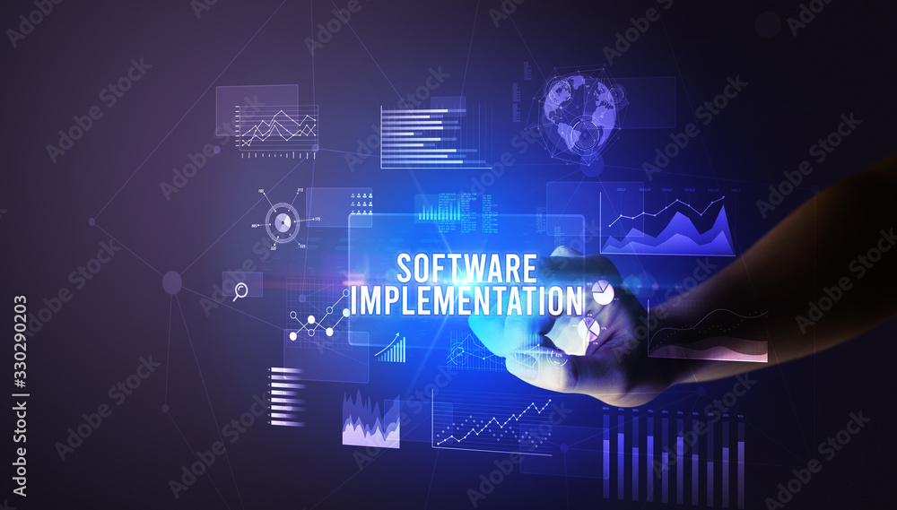 Hand touching SOFTWARE IMPLEMENTATION inscription, new business technology concept Hand touching SOFTWARE IMPLEMENTATION inscription, new business technology concept