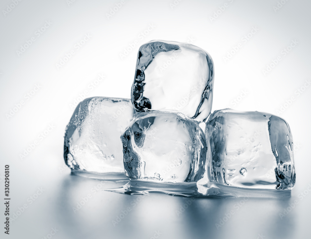 Group of natural crystal clear melting ice cubes on white background. Group of natural crystal clear melting ice cubes on white background.
