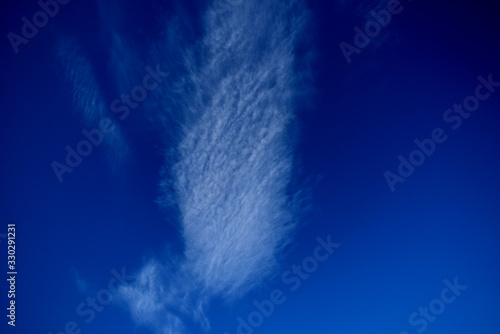 Clouds are floating high in the blue sky. photo