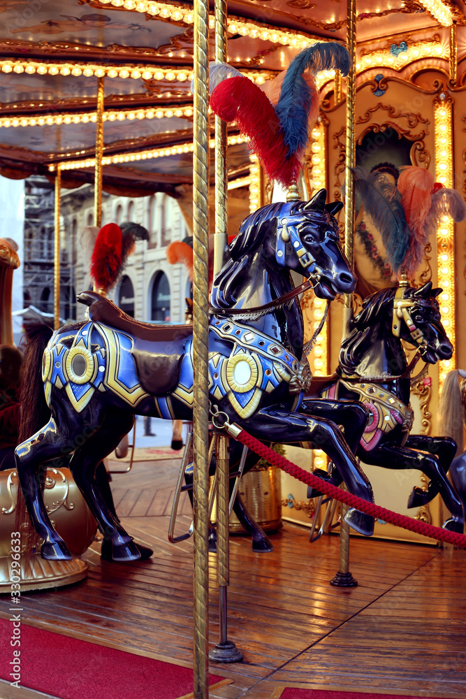 Traditional classic French styled vintage colorful horse carousel in the town square