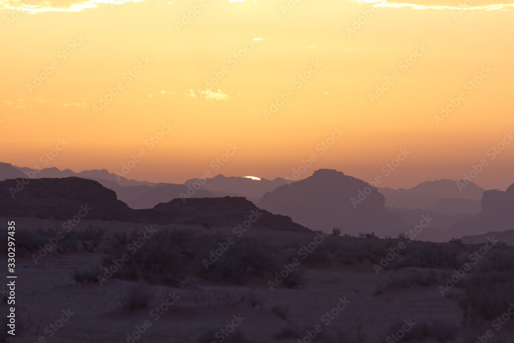Landscape of Wadi Rum hills and desert in Jordan just before a beautiful sunset in the Spring