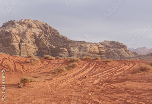 Landscape of a red sand dune in Wadi Rum in Jordan just before sunset