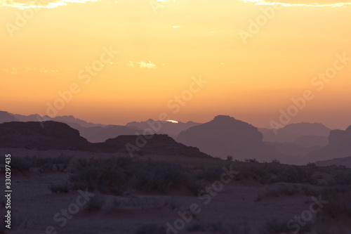 Landscape of Wadi Rum hills and desert in Jordan just before a beautiful sunset in the Spring © Thomas