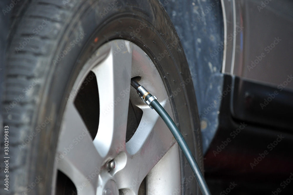 Pump air into a tire Pump air into a tire