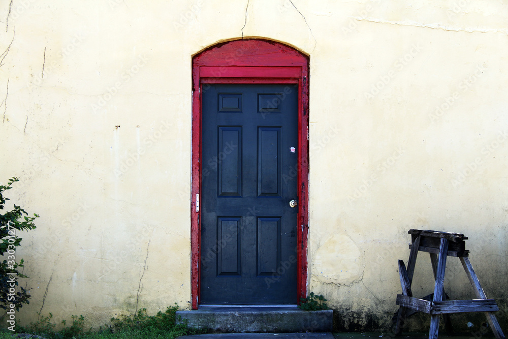 black door red trim vintage workshop entrance