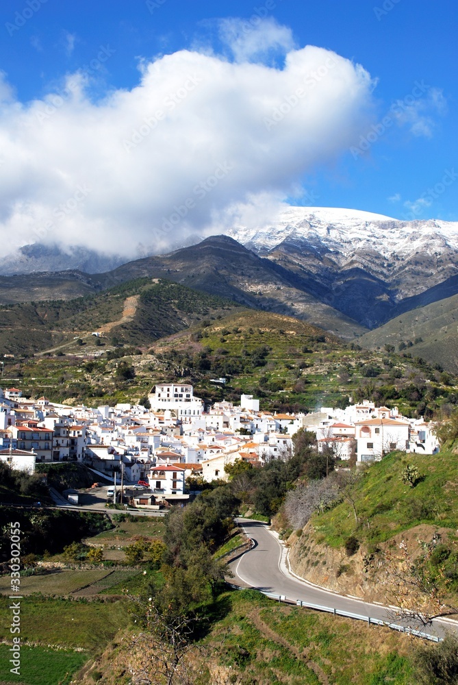 View of the whitewashed village (pueblo blanco) in the mountains, Sedella, Spain.
