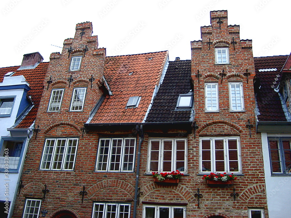 Naklejka premium Old brick buildings. Brick gothic architecture, Lubeck, Germany