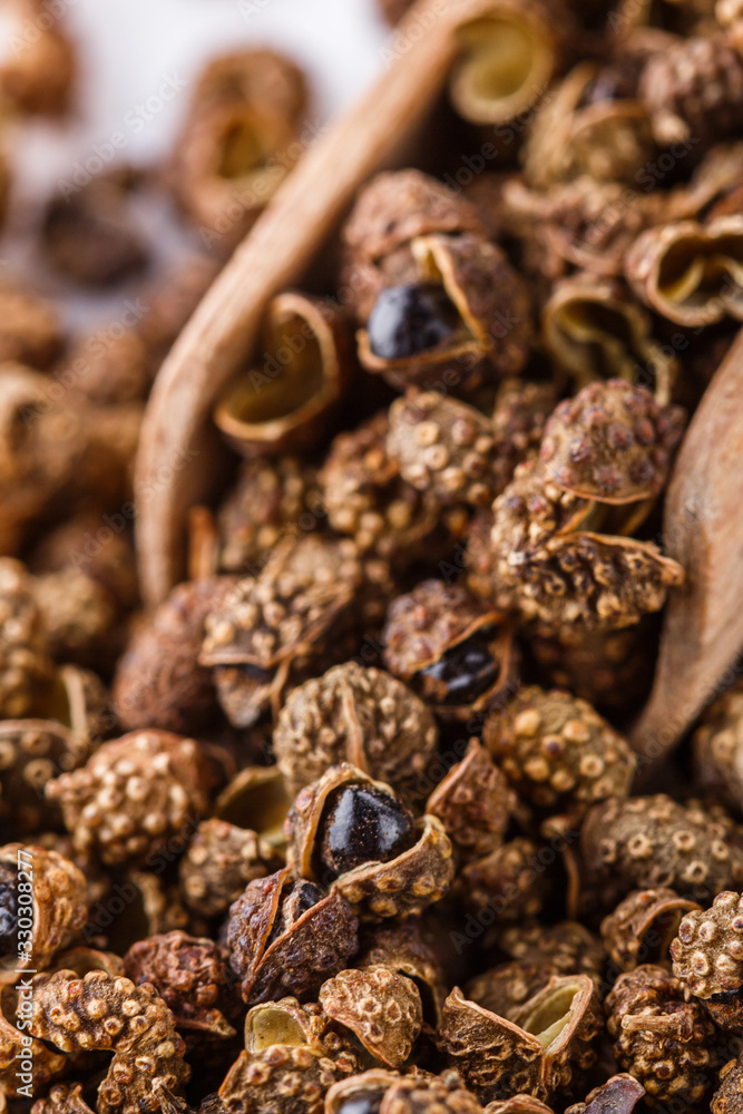 fragrant Sichuan pepper on white acrylic background fragrant Sichuan pepper on white acrylic background