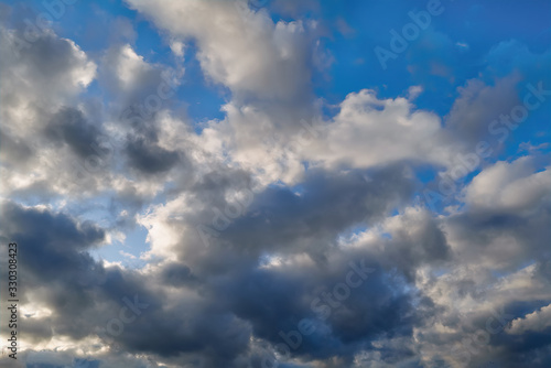 Blue summer sky with white cumulus clouds. Blue sky with clouds nature background. © Anatoliy