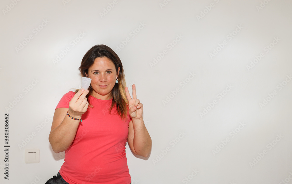 Woman holding tampon and menstrual cup on her hands. Comparative products. Saving money and taking care of our planet. Woman holding tampon and menstrual cup on her hands. Comparative products. Saving money and taking care of our planet.
