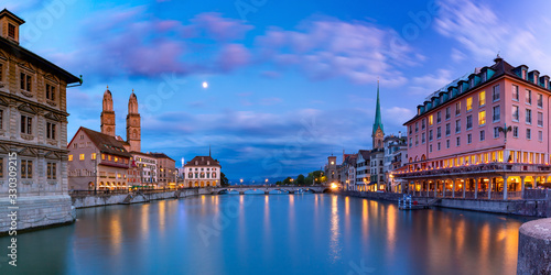 Famous Fraumunster, Grossmunster and Wasserkirche churches along river Limmat at sunset in Old Town of Zurich, the largest city in Switzerland
