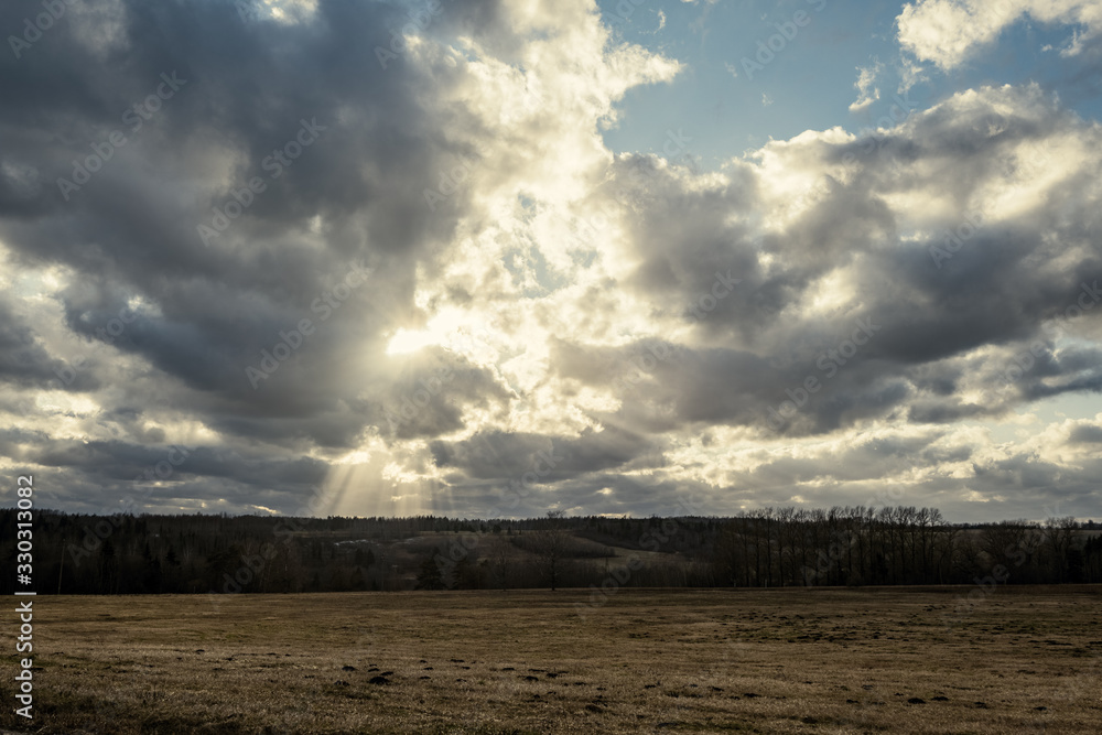 Fototapeta premium sunset over the lake with dramatic clouds