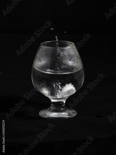 Dissolution of aspirin in a glass of water