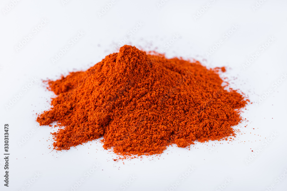 fragrant ground paprika on a white acrylic background fragrant ground paprika on a white acrylic background