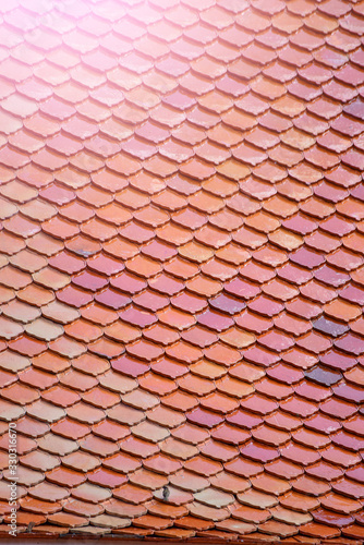 Tile Roof pattern background with color tone sunlight.