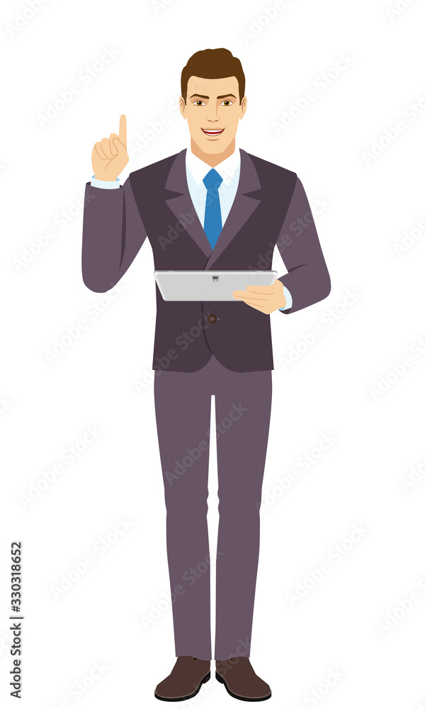 Smiling Businessman holding digital tablet PC and pointing up. Full length portrait of Businessman in a flat style. Smiling Businessman holding digital tablet PC and pointing up. Full length portrait of Businessman in a flat style.