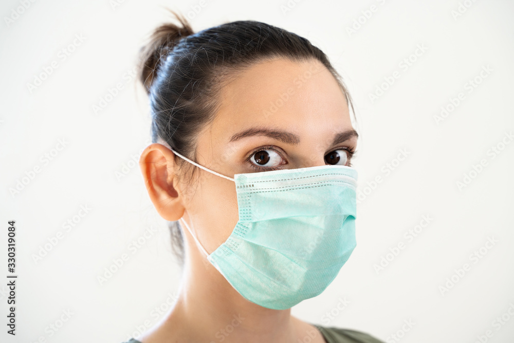 Portrait of young woman with medical mask. Covid-19 epidemic Portrait of young woman with medical mask. Covid-19 epidemic