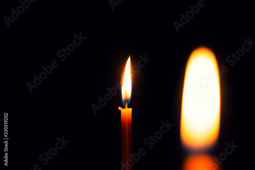 Two yellow candles, burns, illuminates, for celebrations, and for romance, of love