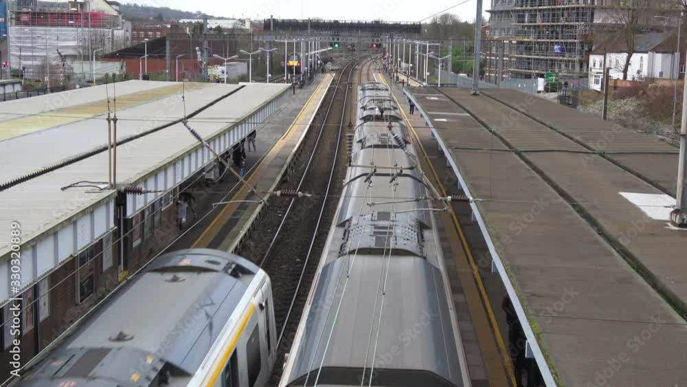4K. Elevated view of Trains at Luton Station in exterior and cloudy day. Railway station in the Luton of London. Transport concept. Without pandemic. 4K. Elevated view of Trains at Luton Station in exterior and cloudy day. Railway station in the Luton of London. Transport concept. Without pandemic.