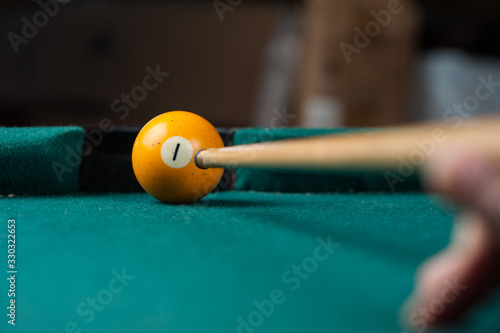 Billiards balls and cue on billiards table. Billiard sport concept