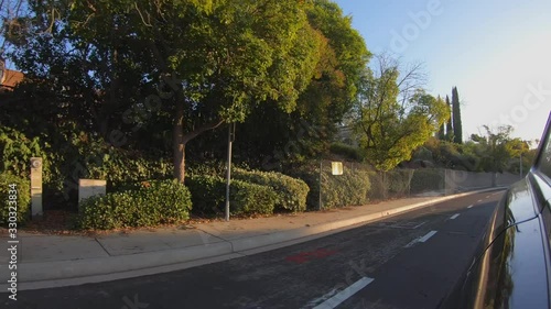 Simi Valley, United States - November 29, 2019: 4K. POV view of car driving on road of streets at day in Simi Valley. Drive on an full road in the dark evening. California.