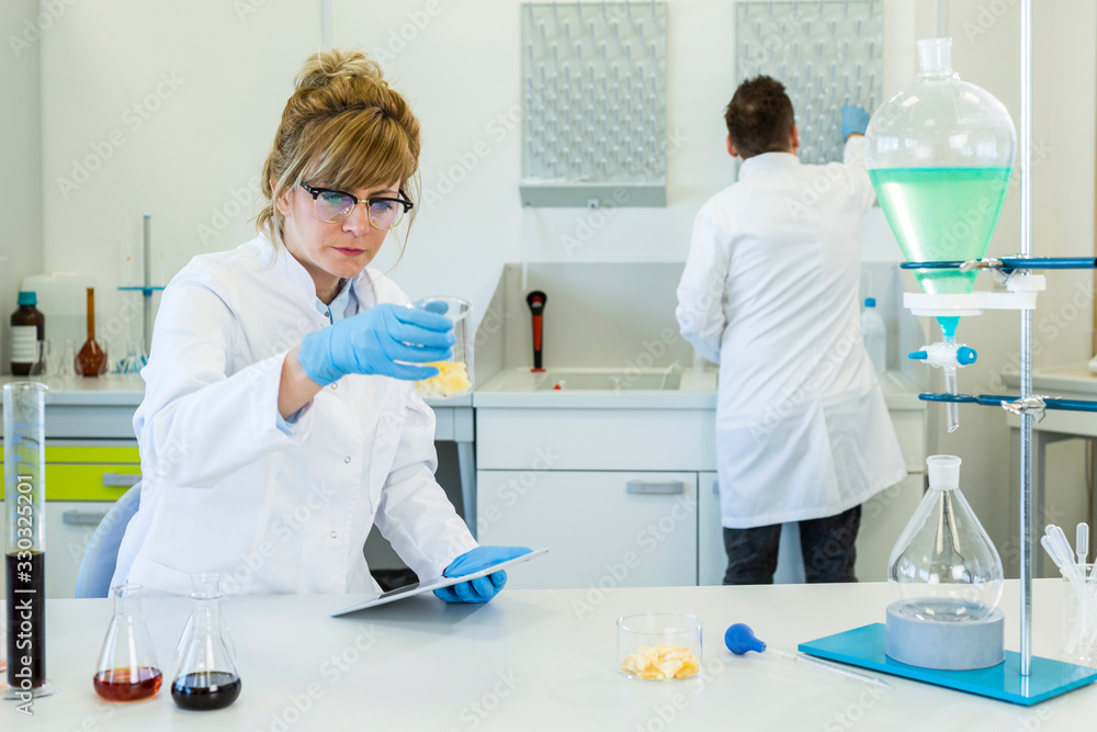 Chemist working with terpene CBD crystals in laboratory Chemist working with terpene CBD crystals in laboratory