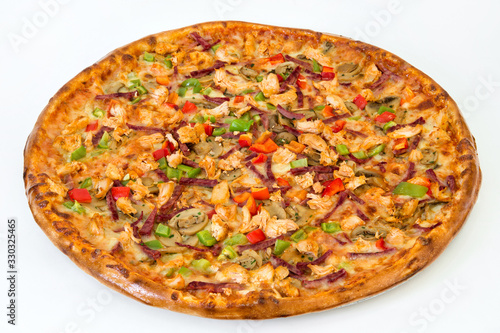 Ham pizza with vegetables and cheese on a plate on a white background