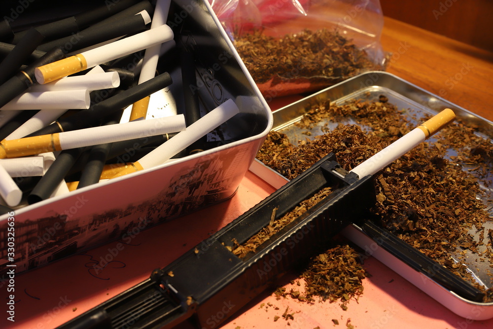 cigarette filters Empty cigarette paper Several white and black