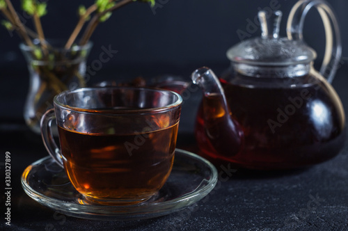 tea in a glass cup on a dark background