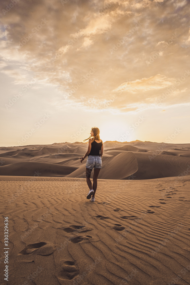 Woman walking in the desert