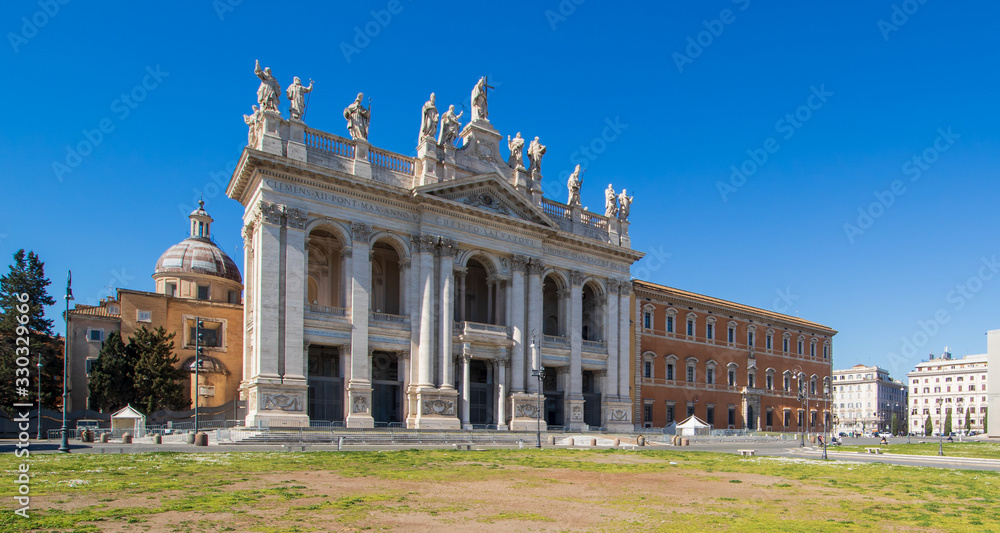 Rome, Italy - following the coronavirus outbreak, the italian Government has decided for a massive curfew. Now, even cities like Rome look like ghost towns. Here in particular the S. Giovanni Basilica