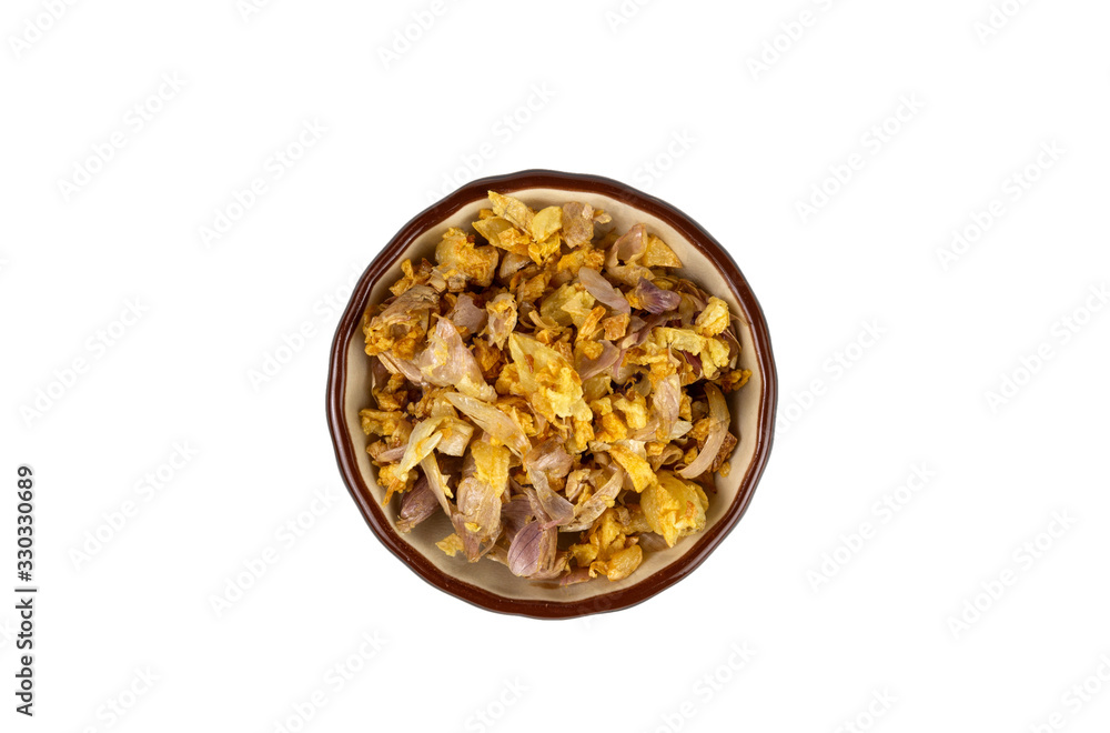 Thai seasoning ,fried garlic in a bowl isolated on white background Thai seasoning ,fried garlic in a bowl isolated on white background