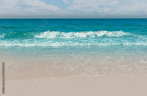 Empty sandy beach and sea with clear sky background