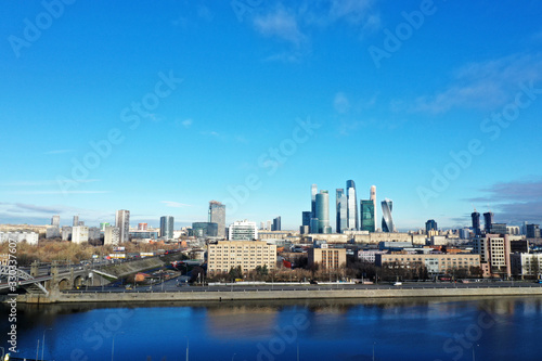 panoramic views of skyscrapers and infrastructure of a large metropolis taken from a drone © константин константи
