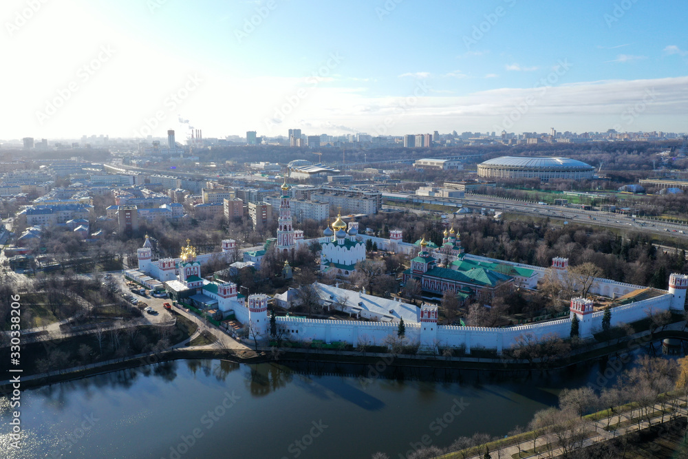panoramic views of the lake, the fortress and the Christian temple of the big metropolis taken from the drone