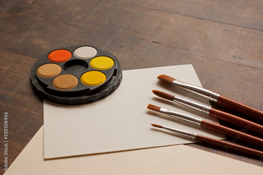 Paper, brush and Watercolor Paper, brush and Watercolor