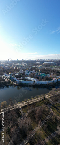 panoramic views of the lake, the fortress and the Christian temple of the big metropolis taken from the drone