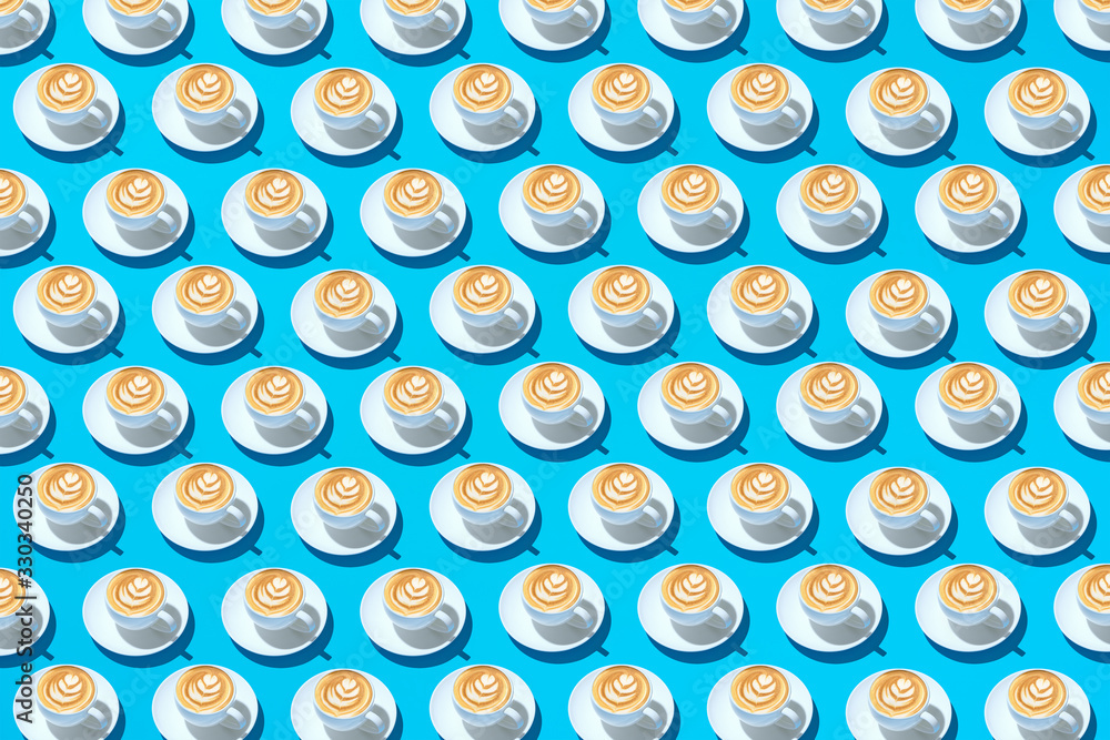Mugs with coffee on a saucer and foam in the form of a flower on a light blue background. Abstract background. Mugs with coffee on a saucer and foam in the form of a flower on a light blue background. Abstract background.