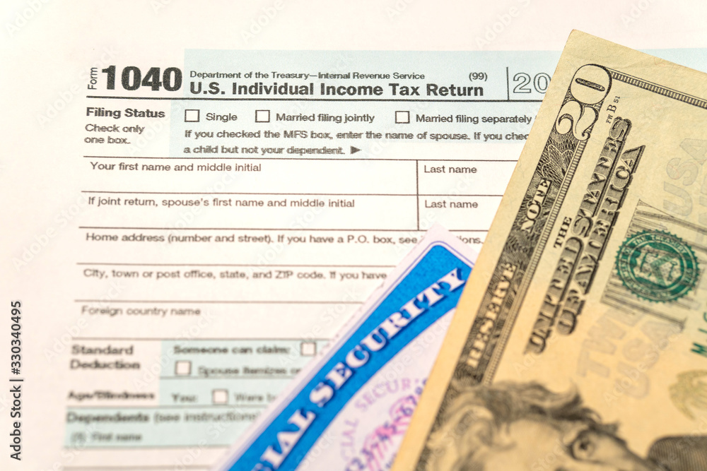 Naklejka premium Individual Income Tax Return Form 1040 and social security card of USA. Submission time. 