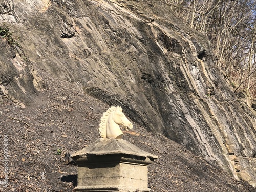 Statue of horse head near mountain