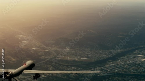 Aerial view of military drone against sunset