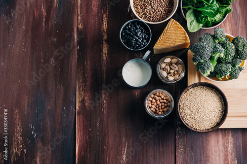 Vegetarian and vegan protein, Natural products on wooden table. Chickpeas, beans, broccoli, quinoa, spinach, pistachios, etc. Animal protein substitute