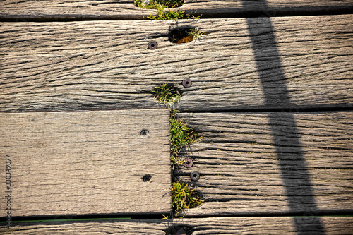 Close-up of brown weathered boardwalk planks background. photo