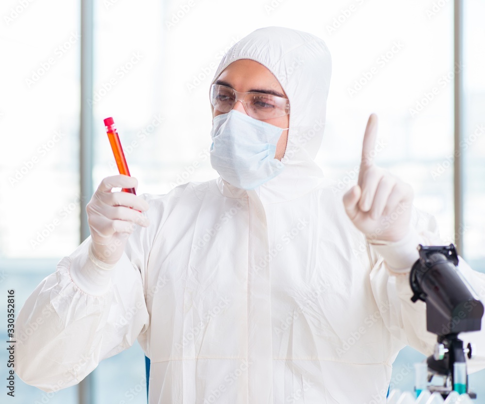 Male chemist working in lab Male chemist working in lab